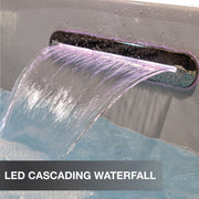 LED cascading waterfall feature with water flowing and purple lighting.