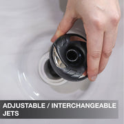 Hand adjusting an adjustable interchangeble jet in a sink