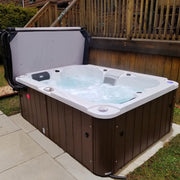 Hot tub with water features on a patio area
